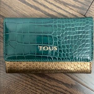 Tous leather wallet.  In mint condition.